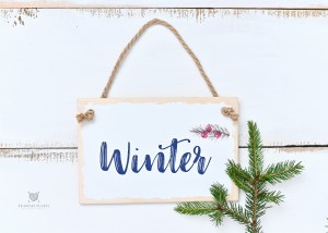 Tabliczka z napisem Winter do sesji świątecznych